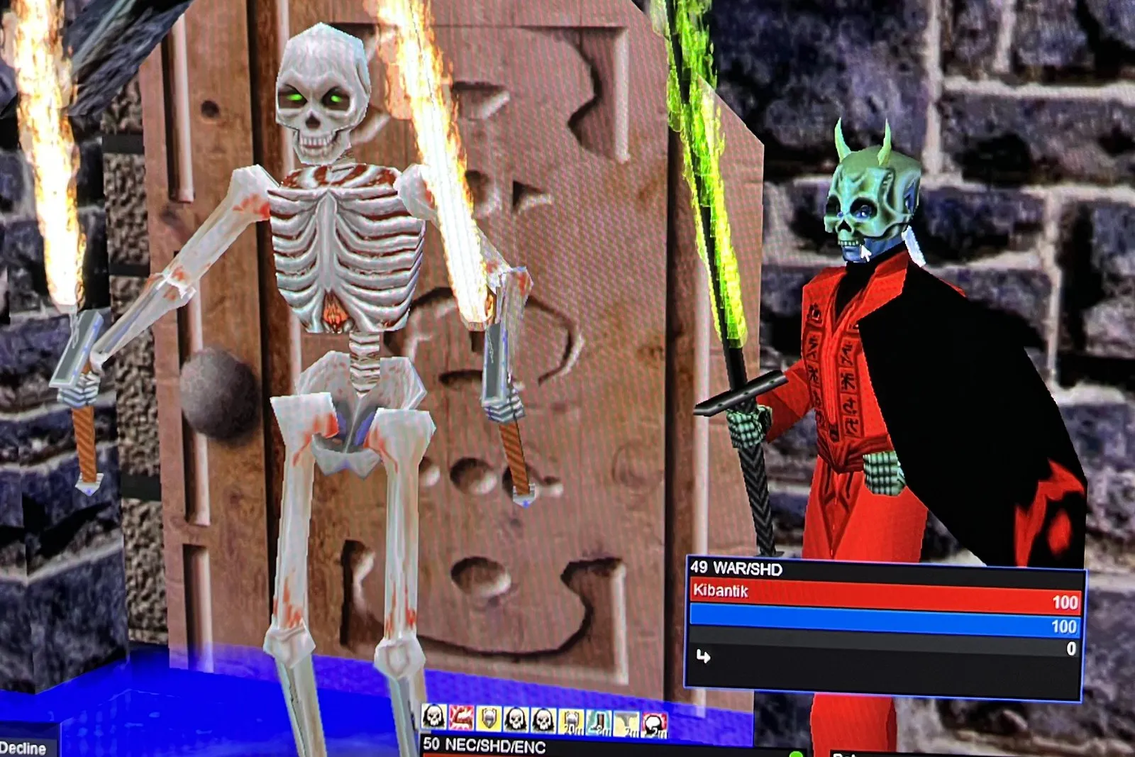 An EverQuest screenshot: a necromancer in red robes beside a skeleton pet holding two flaming swords